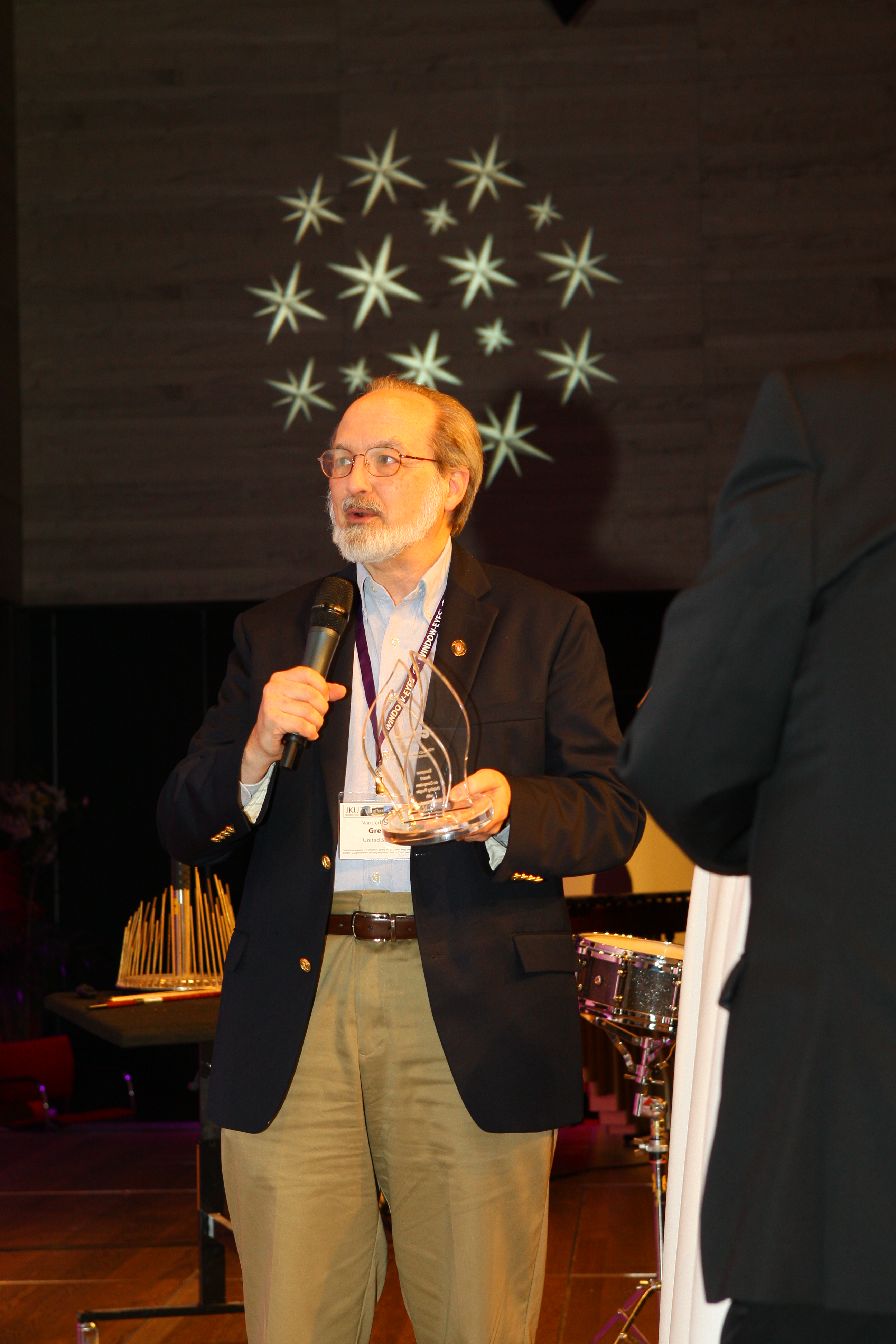 Photo Gregg Vanderheiden holding the award